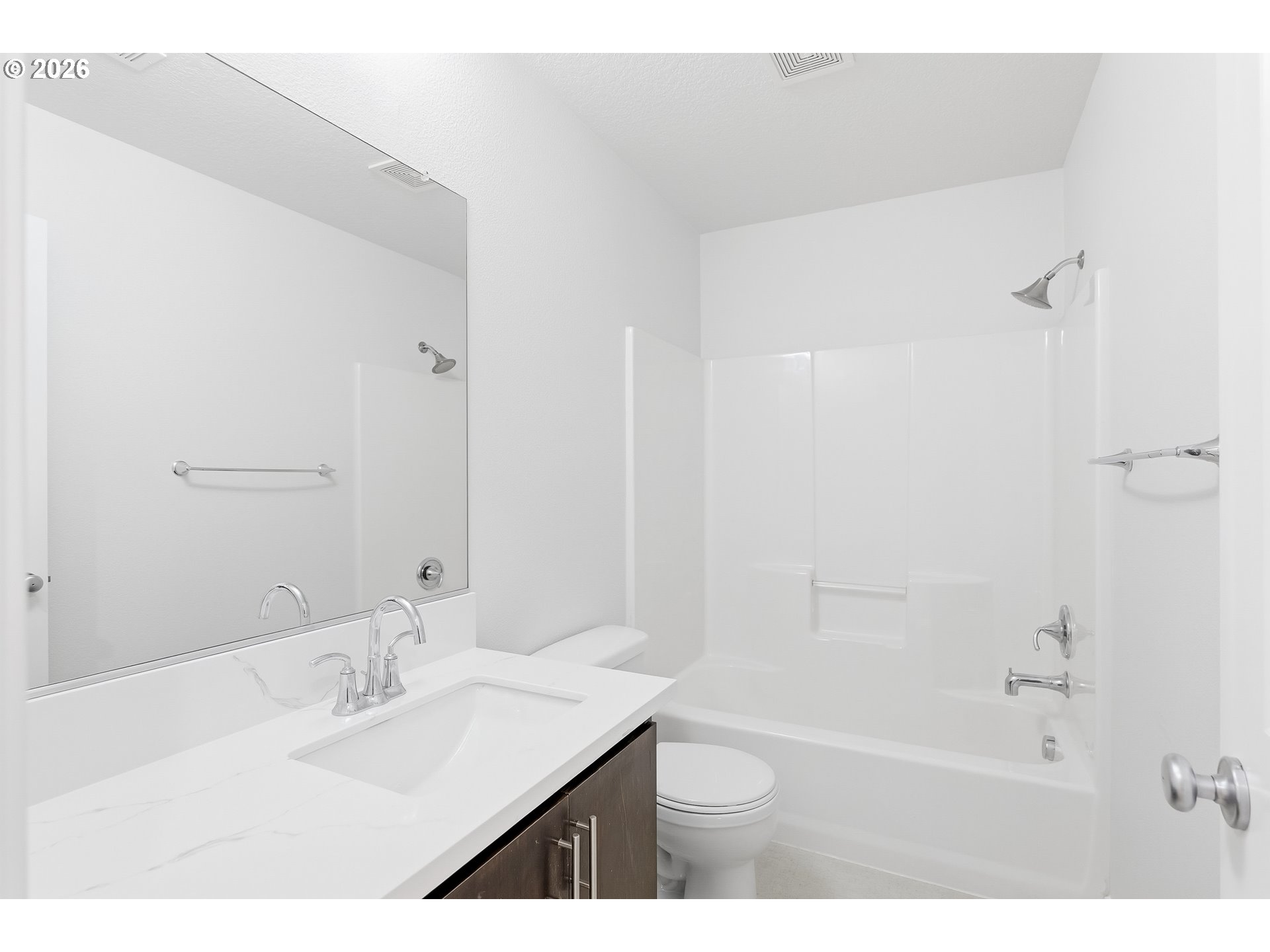 16012 Northwest Centine Lane Portland, OR 97229 - Photo 21 of 24 a bathroom with a bathtub shower sink vanity and a mirror