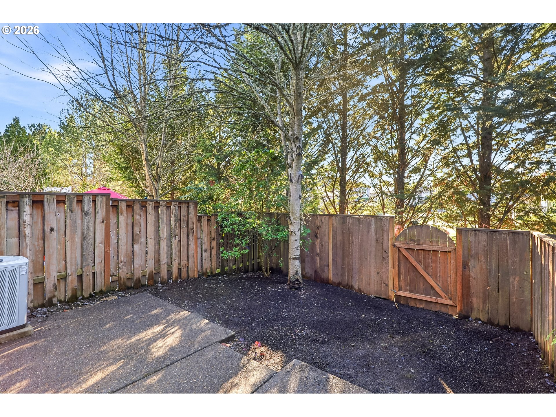 16012 Northwest Centine Lane Portland, OR 97229 - Photo 23 of 24 a view of a backyard with wooden fence