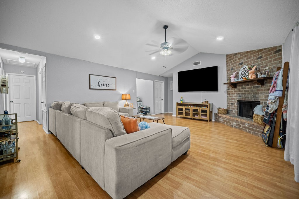 2302 Memorial Parkway Portland, TX 78374 - Photo 7 of 21 a living room with fireplace furniture and a flat screen tv