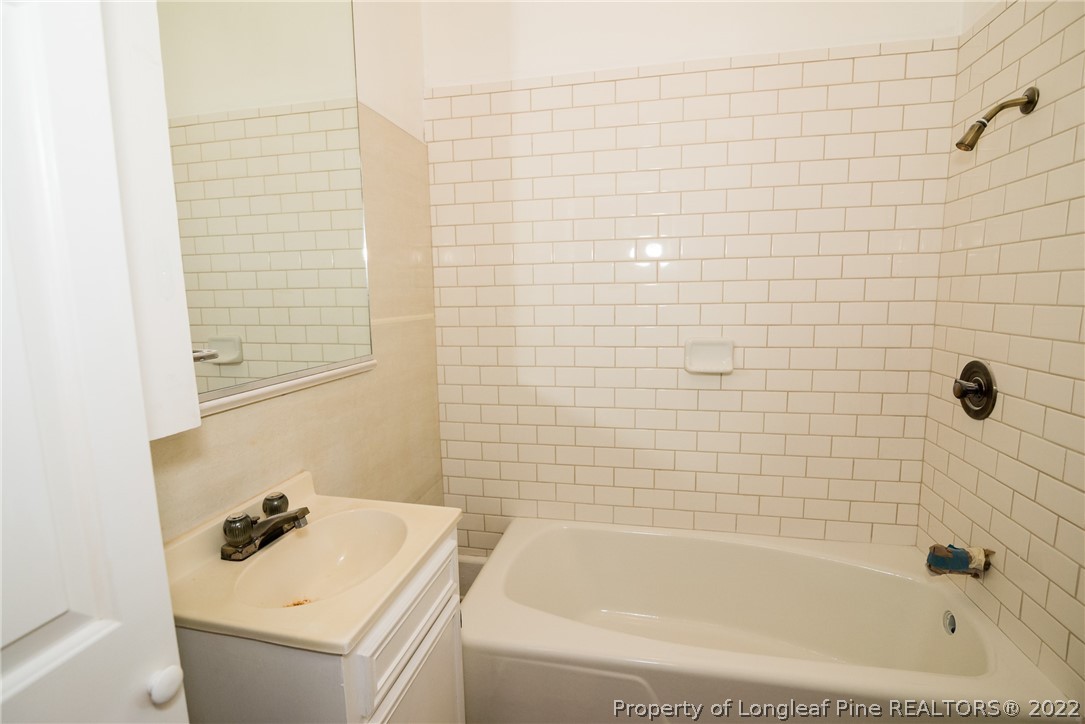 3316 Old River Road Carthage, NC 28327 - Photo 25 of 35 a bathroom with a tub sink and mirror