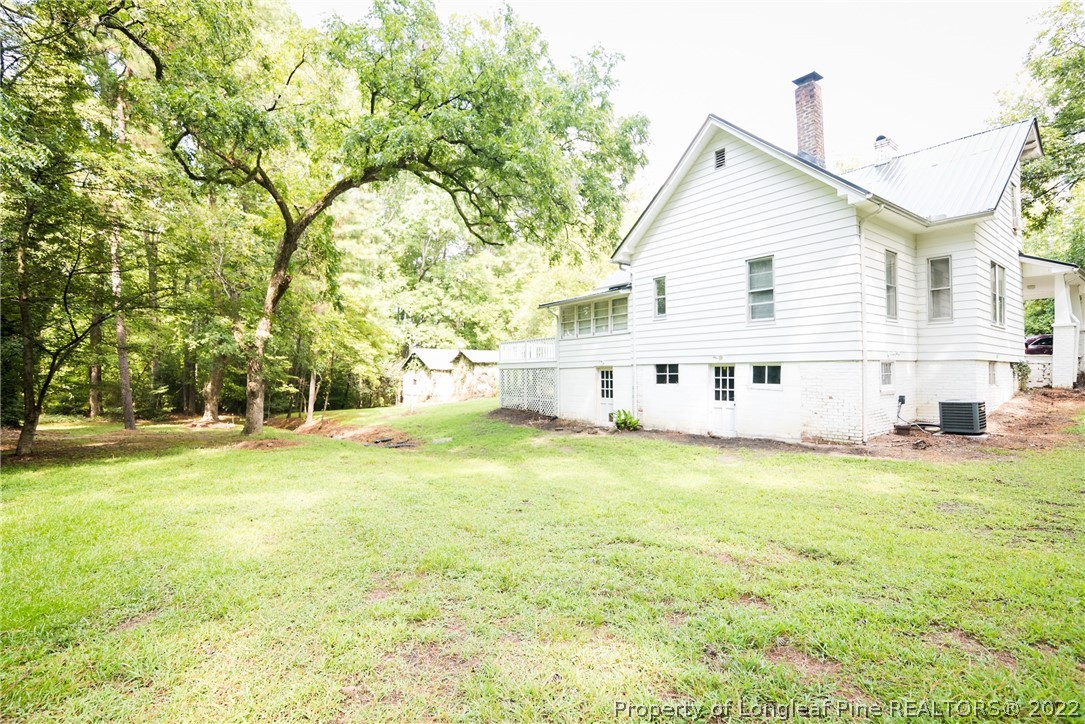 3316 Old River Road Carthage, NC 28327 - Photo 31 of 35 a view of a house with a yard and sitting area