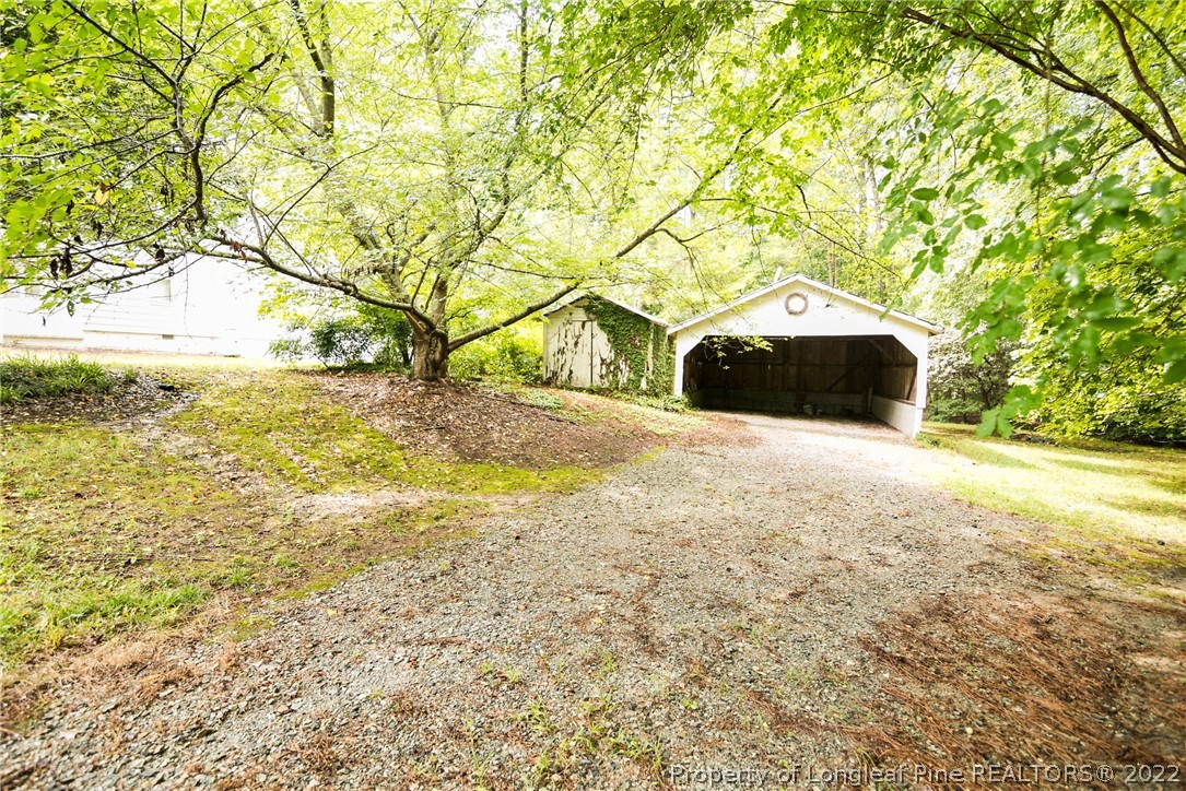 3316 Old River Road Carthage, NC 28327 - Photo 34 of 35 a view of a yard with an outdoor space