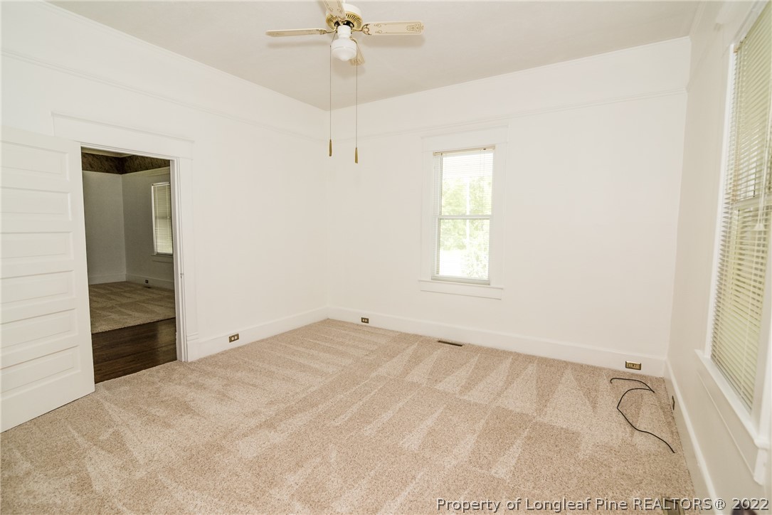 3316 Old River Road Carthage, NC 28327 - Photo 4 of 35 an empty room with fan and windows