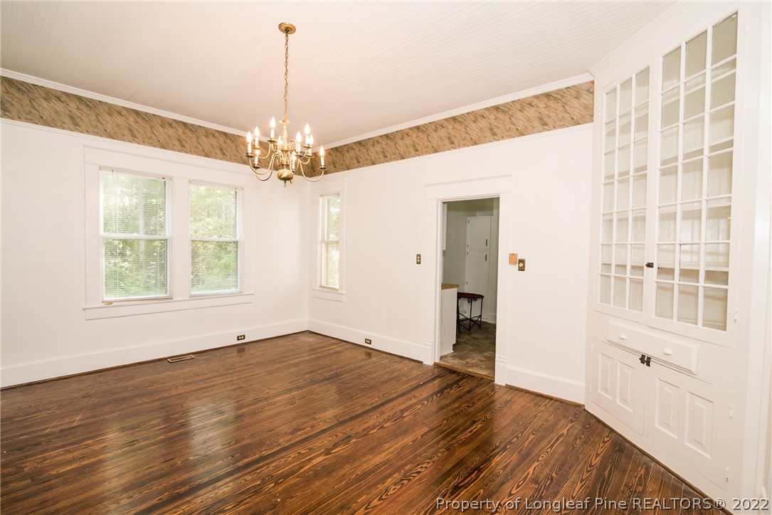3316 Old River Road Carthage, NC 28327 - Photo 8 of 35 a view of an empty room with wooden floor and a window