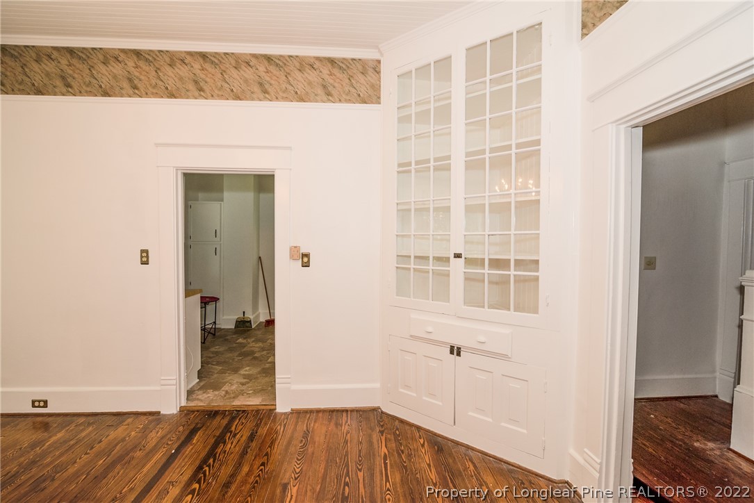 3316 Old River Road Carthage, NC 28327 - Photo 9 of 35 a view of a hallway with wooden floor and a bathroom