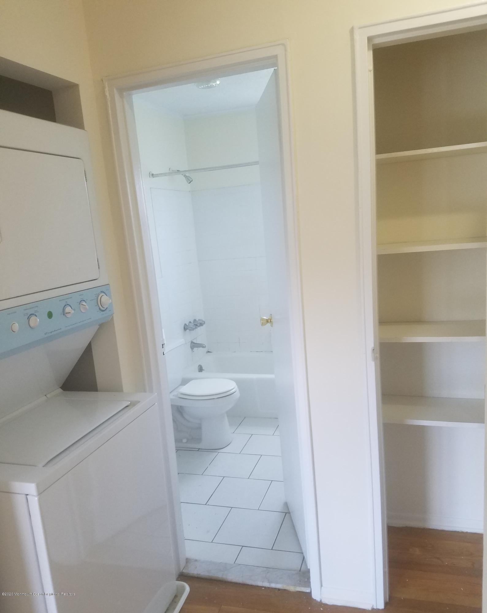 2 Sutton Drive, Unit P04 Matawan, NJ 07747 - Photo 6 of 8 a bathroom with a toilet and a tub