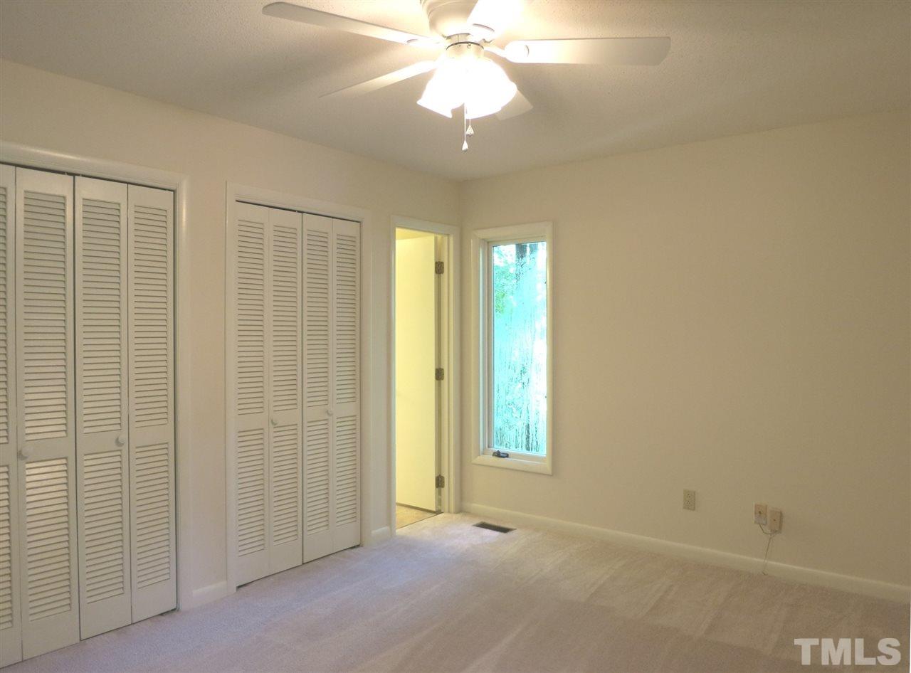 9209 Litchford Road Raleigh, NC 27615 - Photo 17 of 25 an empty room with windows and fan