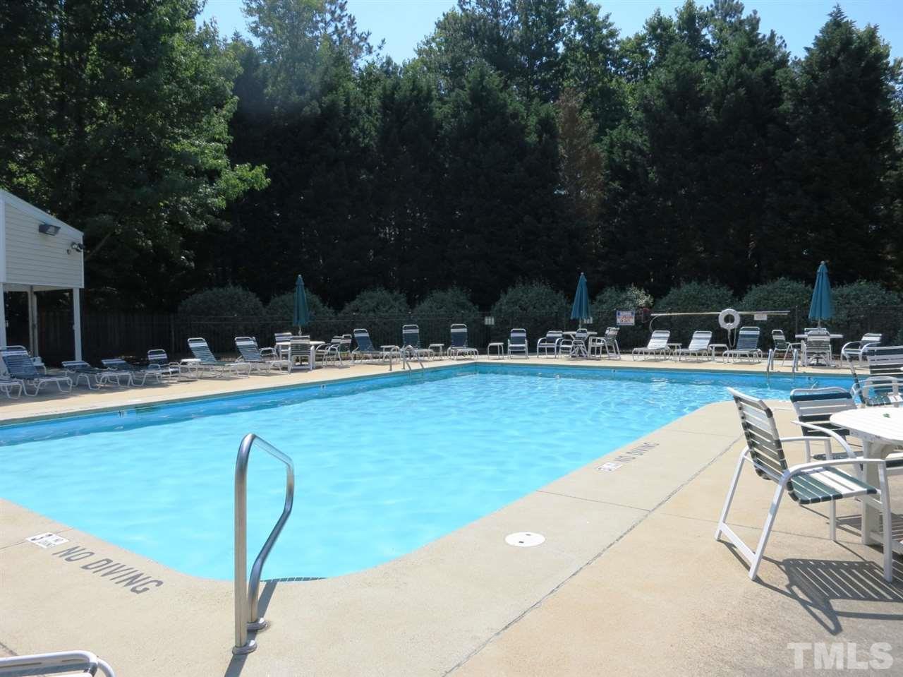 9209 Litchford Road Raleigh, NC 27615 - Photo 24 of 25 a swimming pool with outdoor seating and yard