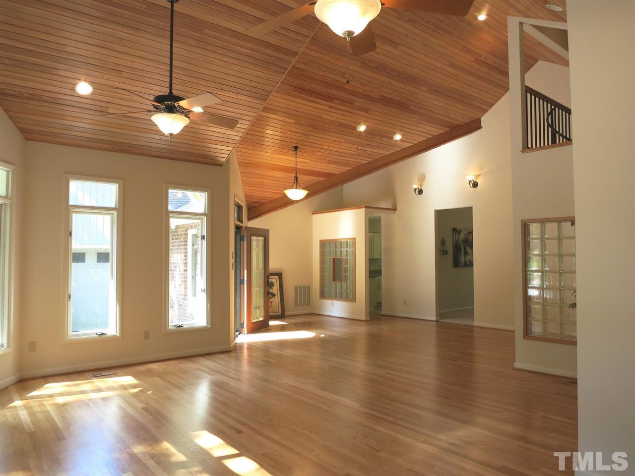 9209 Litchford Road Raleigh, NC 27615 - Photo 5 of 25 a view of a hallway with wooden floor