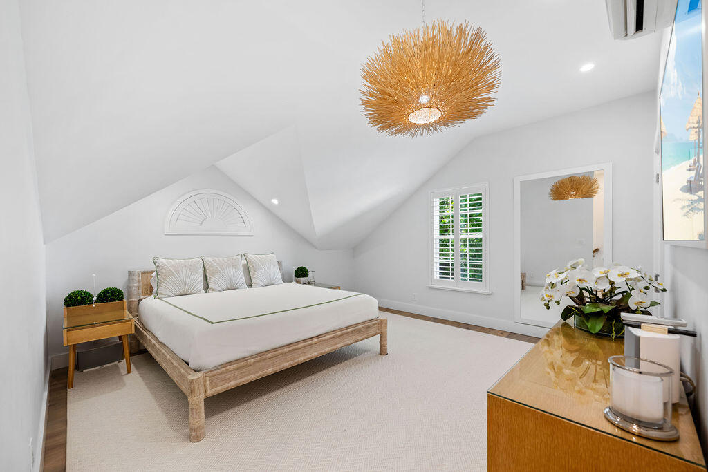 173 Peruvian Avenue, Unit 5 Palm Beach, FL 33480 - Photo 7 of 12 a bedroom with a bed and window