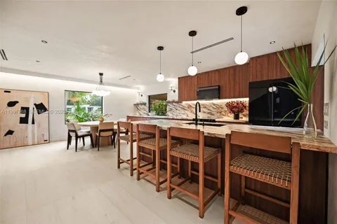 a kitchen with a table and chairs in it