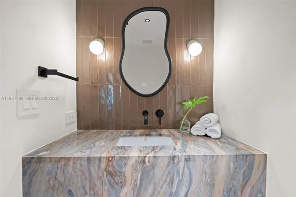 a view of a hallway with a kitchen