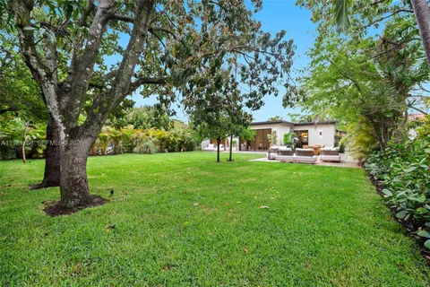 a house view with a garden space