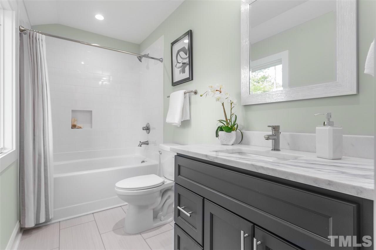 2209 Nancy Ann Drive Raleigh, NC 27607 - Photo 20 of 30 Enjoy the large en-suite bath off of bedroom 3.