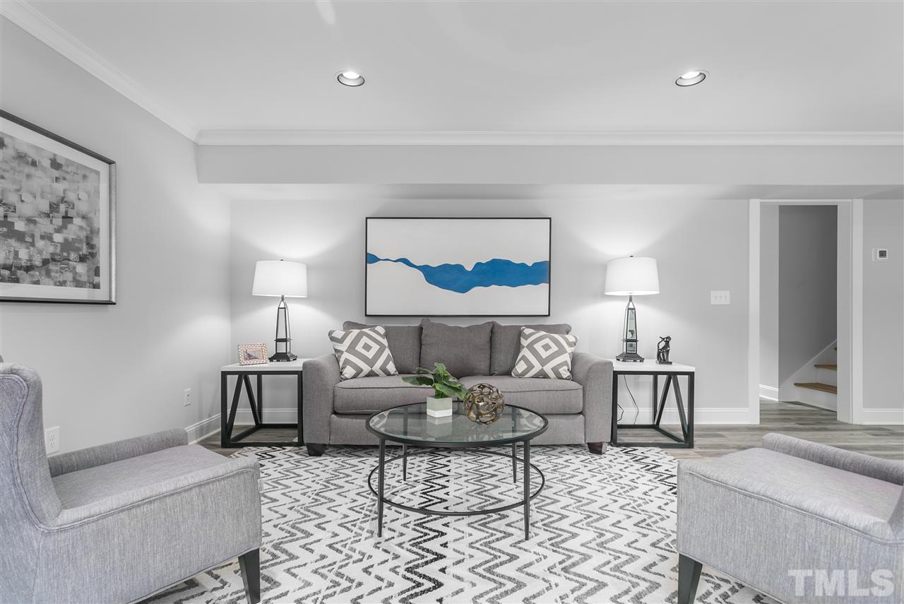 2209 Nancy Ann Drive Raleigh, NC 27607 - Photo 22 of 30 Located on the lower level, the large living room offers flexibility.
