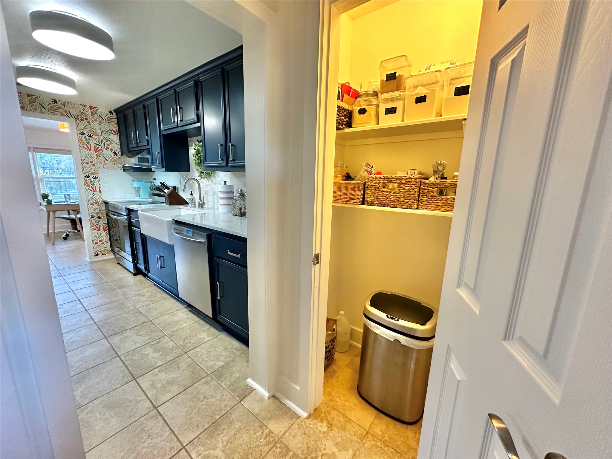 29 Presidio Road Wimberley, TX 78676 - Photo 17 of 36 a kitchen with stainless steel appliances granite countertop a refrigerator and a sink