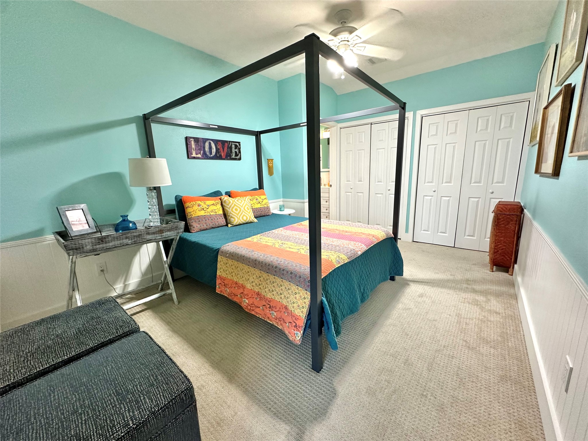29 Presidio Road Wimberley, TX 78676 - Photo 23 of 36 a bedroom with a bed and a painting on the wall