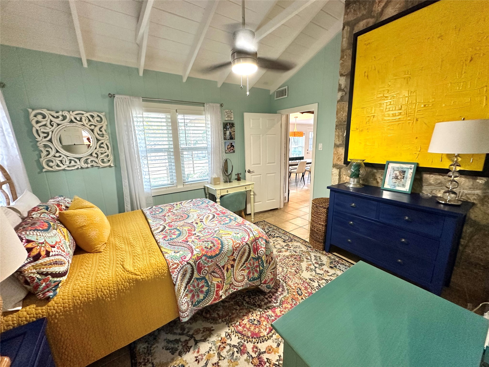 29 Presidio Road Wimberley, TX 78676 - Photo 27 of 36 a bedroom with a bed and wooden floor