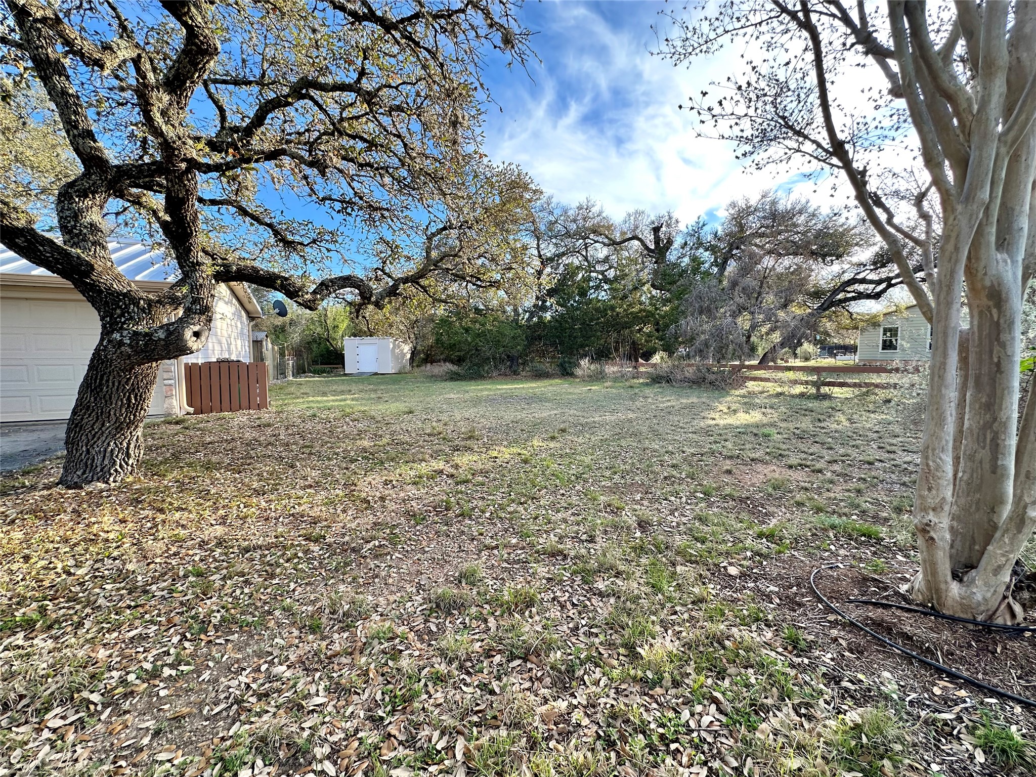 29 Presidio Road Wimberley, TX 78676 - Photo 5 of 36 a view of a yard with a tree