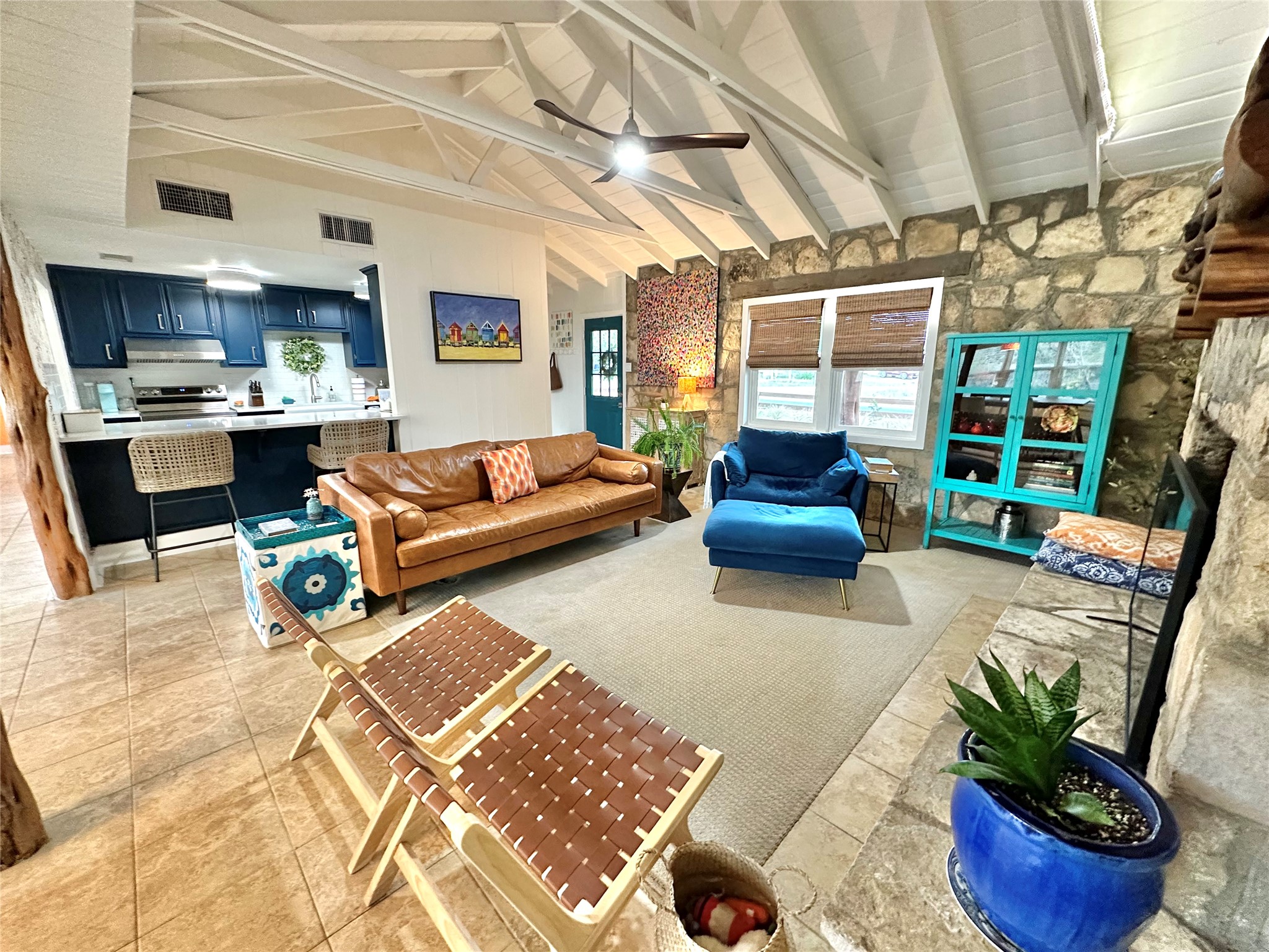 29 Presidio Road Wimberley, TX 78676 - Photo 8 of 36 a living room with furniture and a book shelf