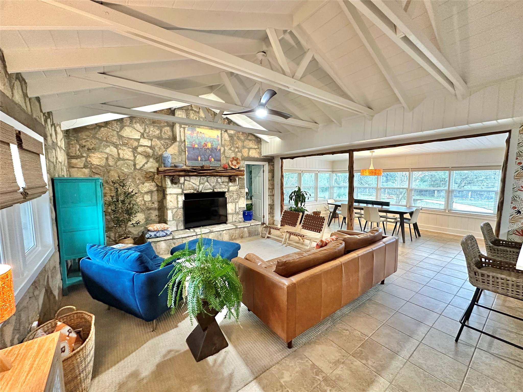 29 Presidio Road Wimberley, TX 78676 - Photo 9 of 36 a living room with furniture a fireplace and a flat screen tv