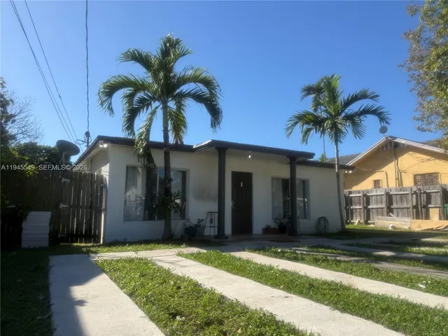 a view of a house with a porch and furniture