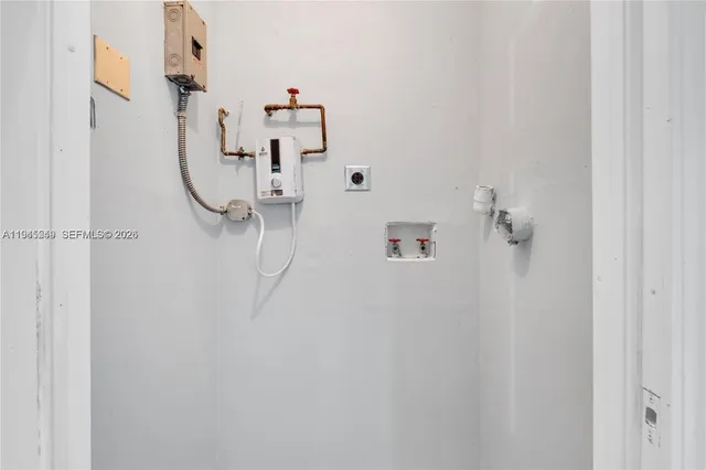 a kitchen with stainless steel appliances a refrigerator and a stove