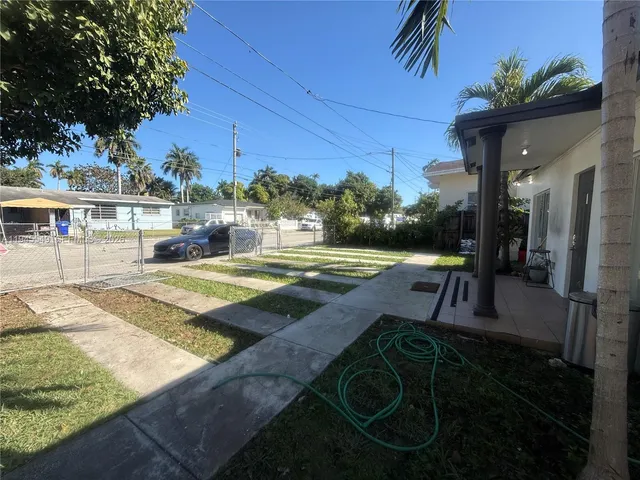 a view of a room with furniture and a window