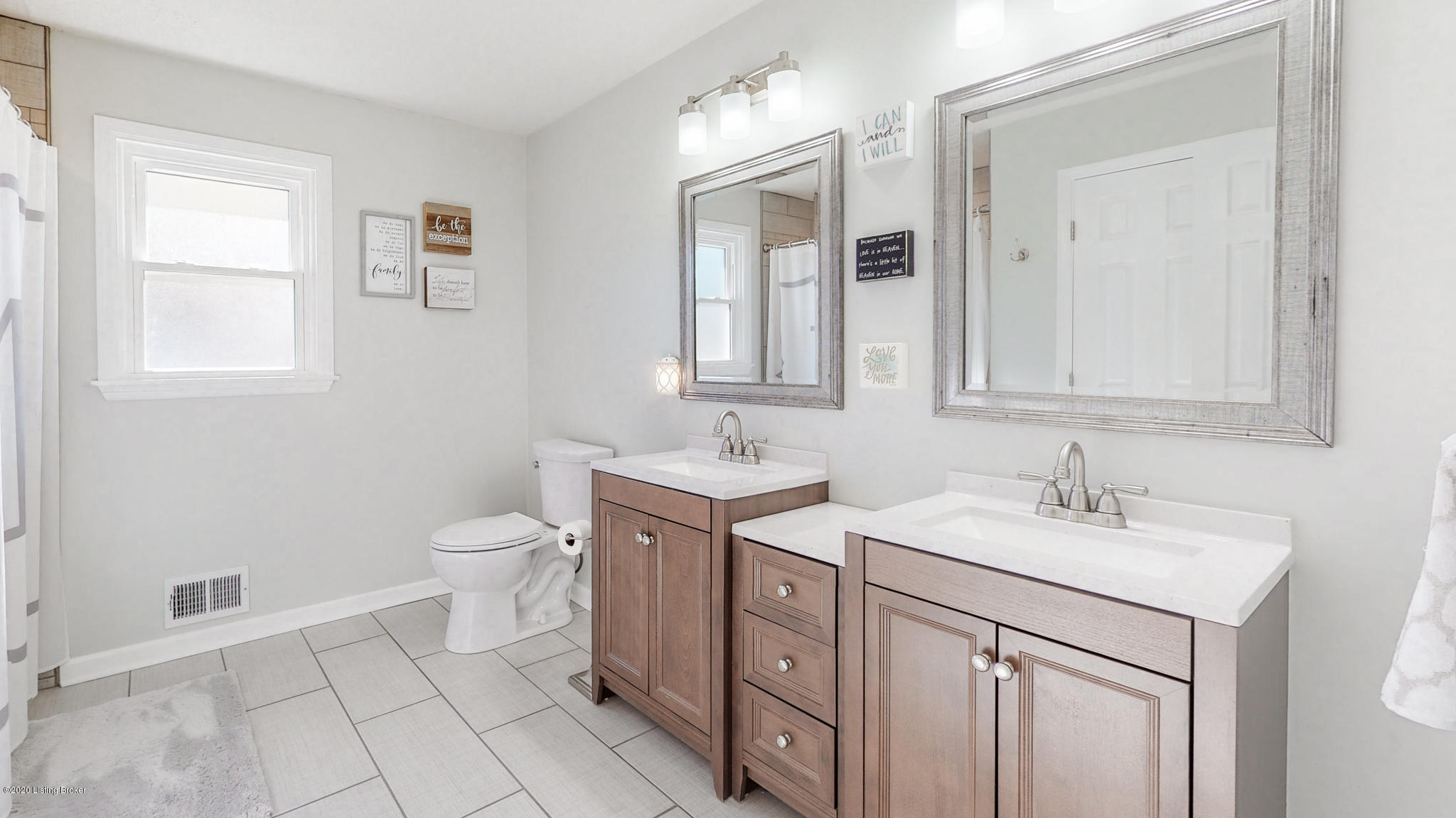 1104 Franelm Road Louisville, KY 40214 - Photo 11 of 39 Updated Bathroom w/ New Flooring, New Vanities, New Lighting, and New Shower Tile