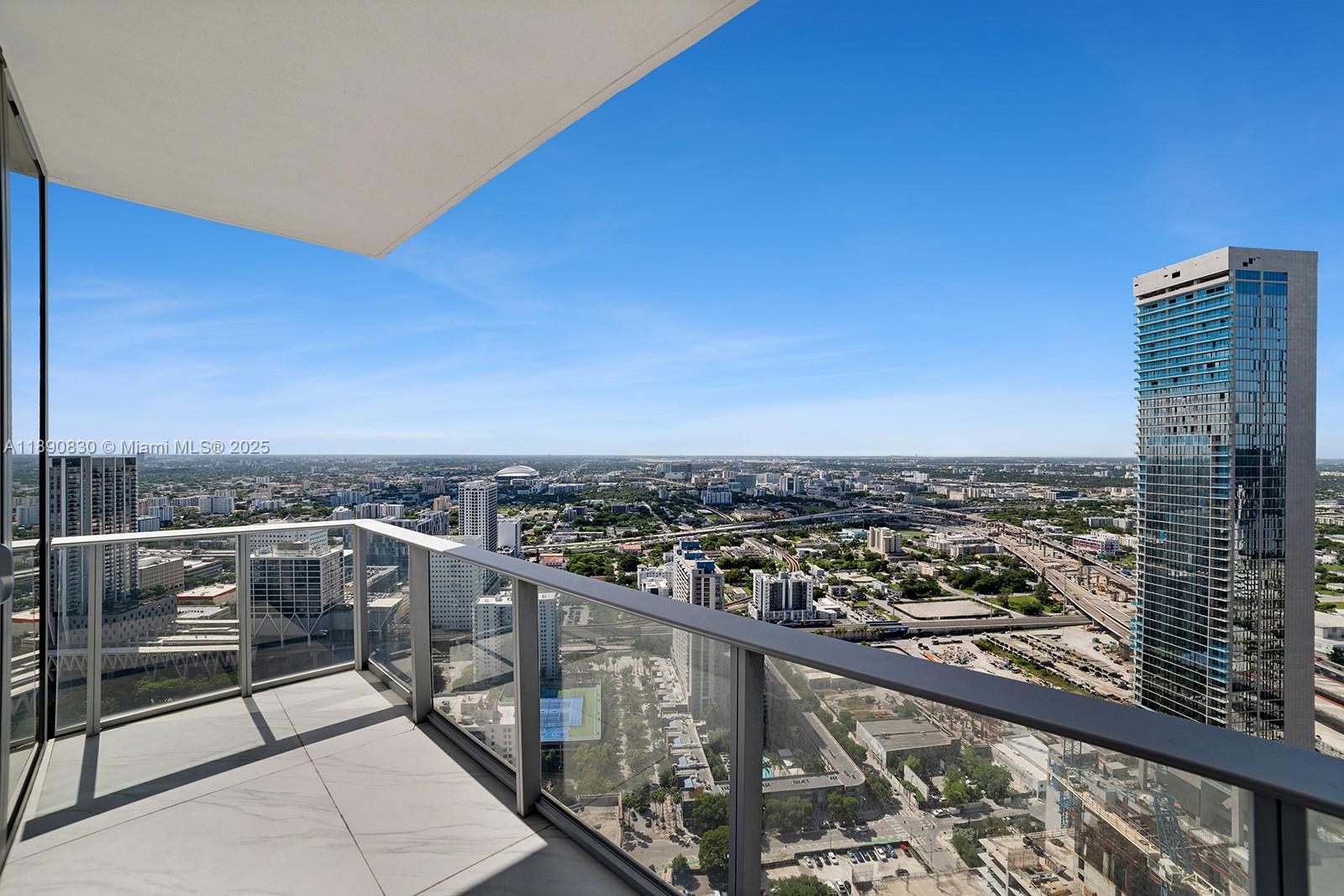 851 Northeast 1st Avenue, Unit 4401/4402 Miami, FL 33132 - Photo 14 of 37 a view of a city from a balcony