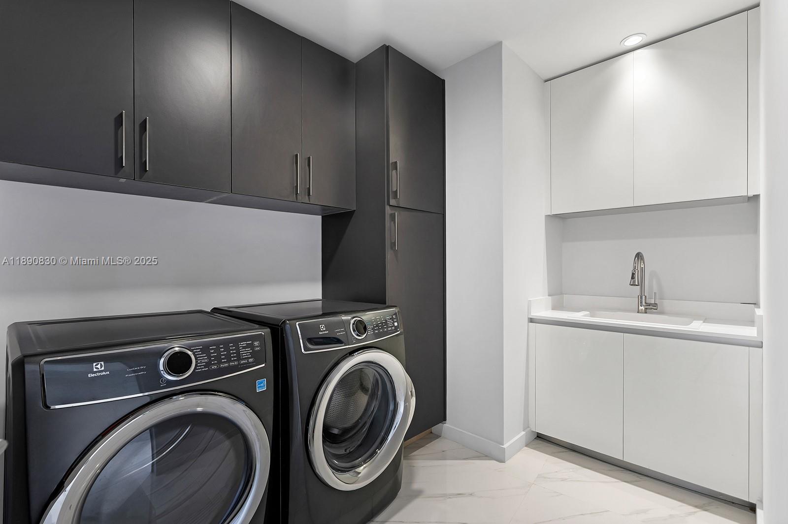 851 Northeast 1st Avenue, Unit 4401/4402 Miami, FL 33132 - Photo 23 of 37 a utility room with sink dryer and washer