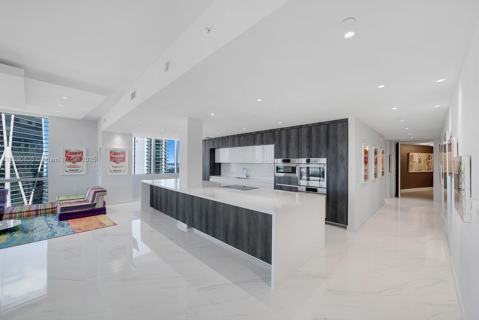 851 Northeast 1st Avenue, Unit 4401/4402 Miami, FL 33132 - Photo 7 of 37 a kitchen with stainless steel appliances a refrigerator and a stove