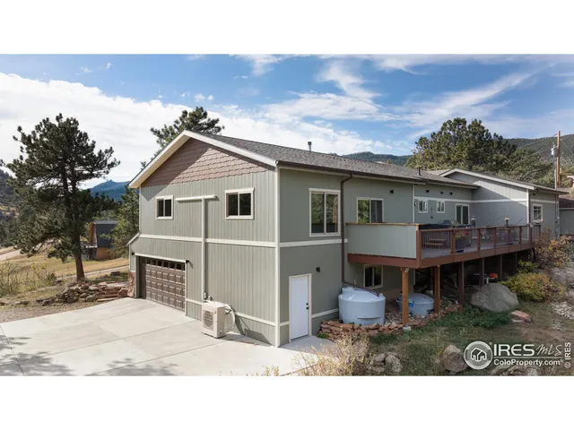 a view of a roof deck with wooden floor and seating