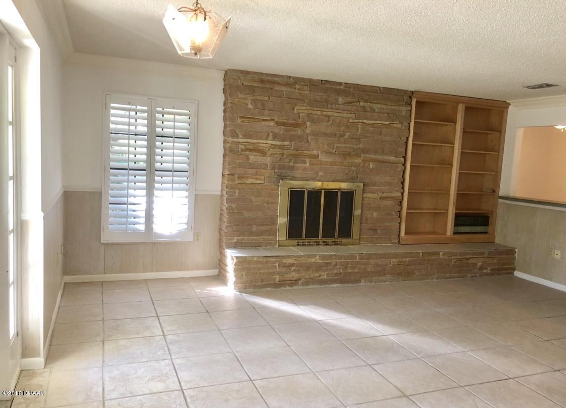 1734 Pinedale Road Edgewater, FL 32132 - Photo 4 of 37 Great Room Fireplace & Built-Ins