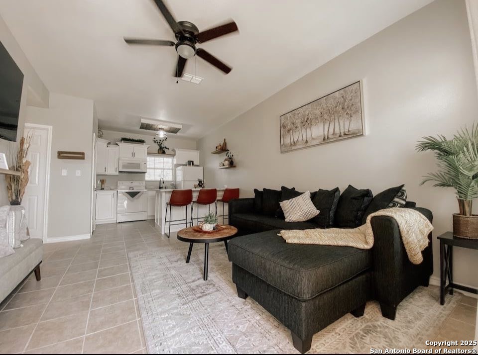 391 Riverside Drive, Unit 21 Eagle Pass, TX 78852 - Photo 5 of 11 a living room with furniture and a flat screen tv