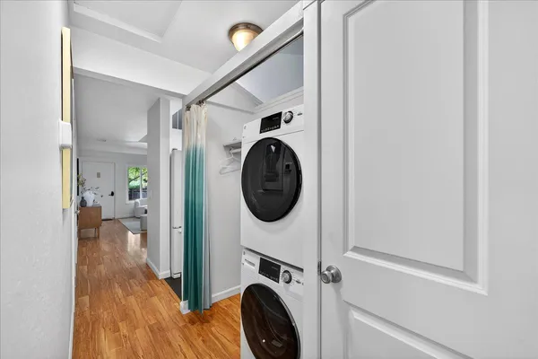 a view of a hallway with washer and dryer