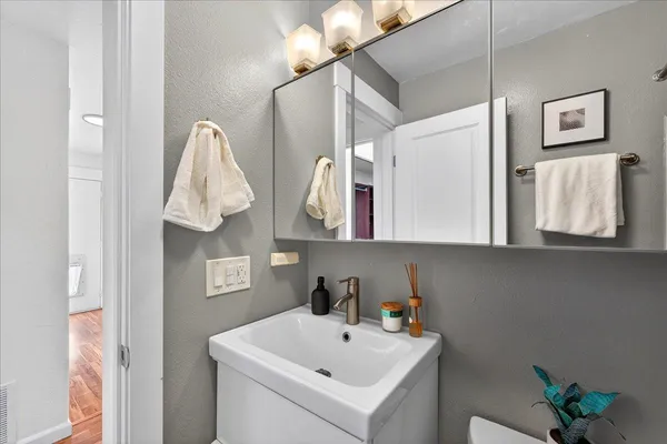 a bathroom with a sink and a mirror