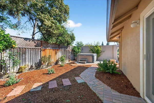 a view of a backyard with sitting area
