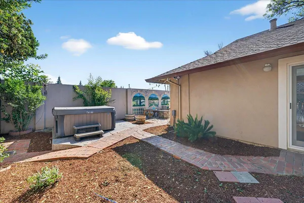 a view of a backyard with sitting area