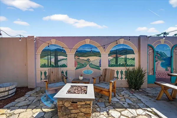 a outdoor space with lots of tables and chairs