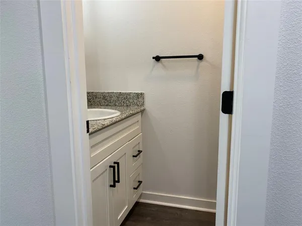 a bathroom with a shower and a sink