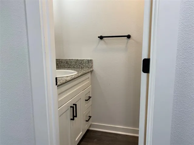 a bathroom with a shower and a sink