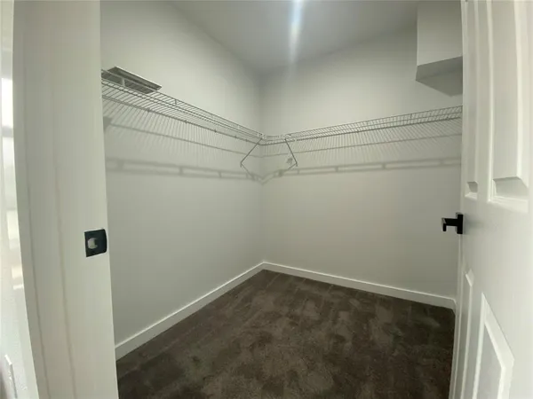 a view of a room with racks on the wall