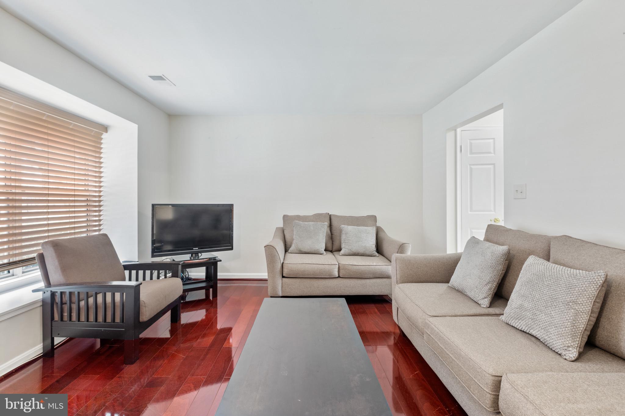 2 Dawn View Court Silver Spring, MD 20904 - Photo 5 of 25 Living room featuring dark wood-type flooring