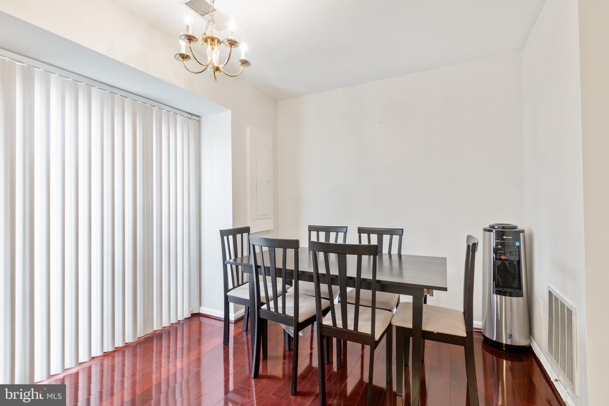 2 Dawn View Court Silver Spring, MD 20904 - Photo 7 of 25 Dining room featuring a notable chandelier and dar