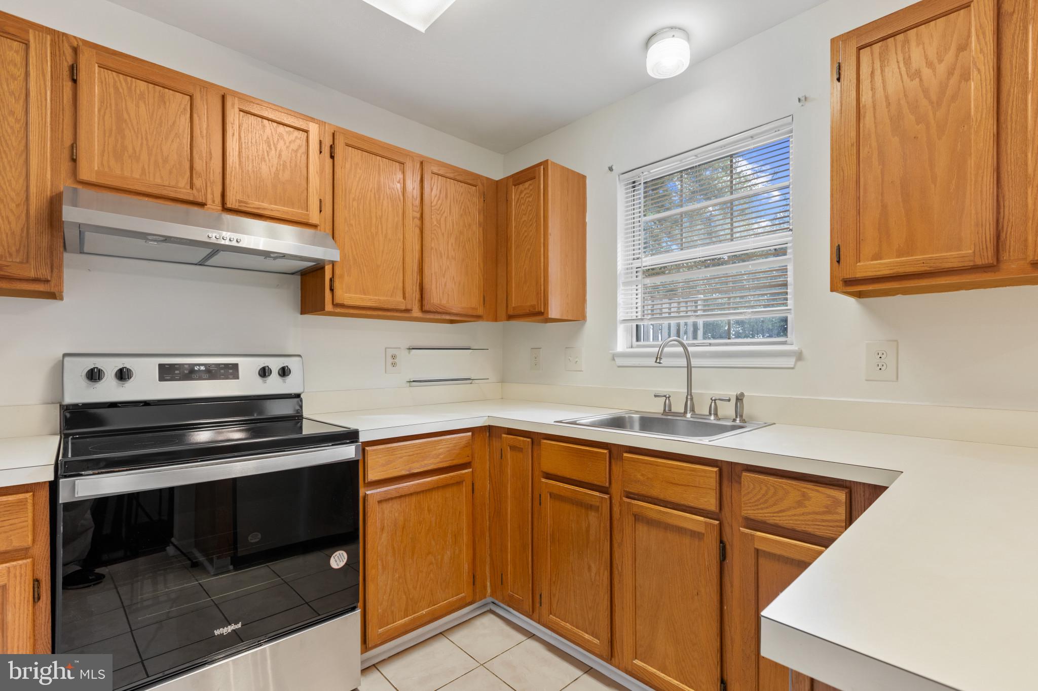 2 Dawn View Court Silver Spring, MD 20904 - Photo 10 of 25 Kitchen featuring light tile flooring, stainless s