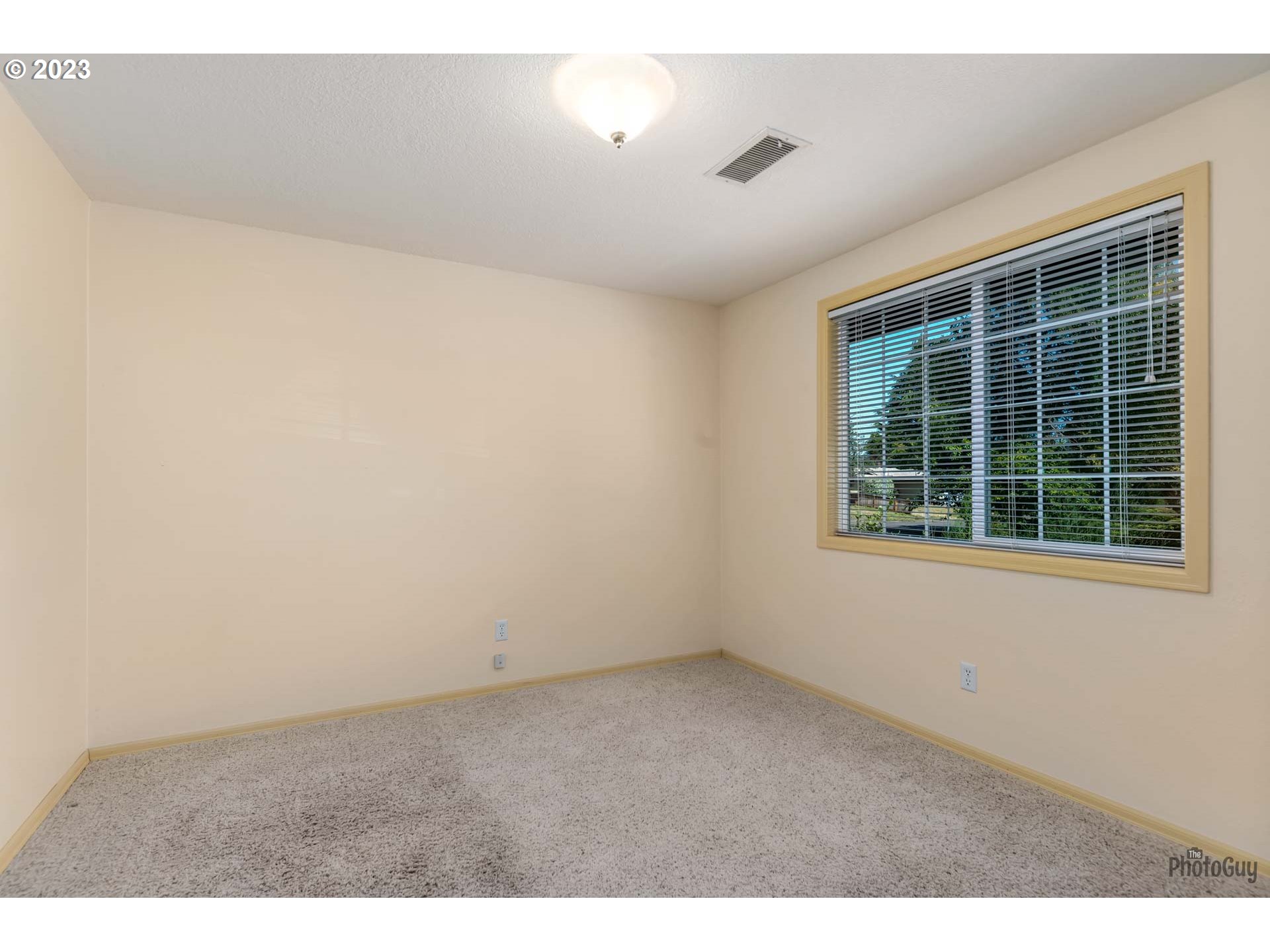 5621 C Street Springfield, OR 97478 - Photo 15 of 29 a view of an empty room with a window