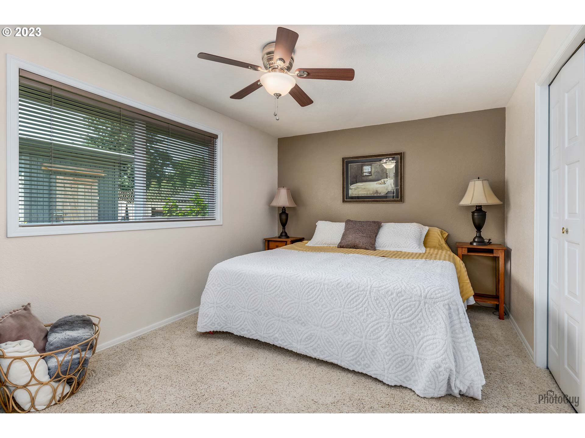 5621 C Street Springfield, OR 97478 - Photo 19 of 29 a bedroom with a bed and a large window