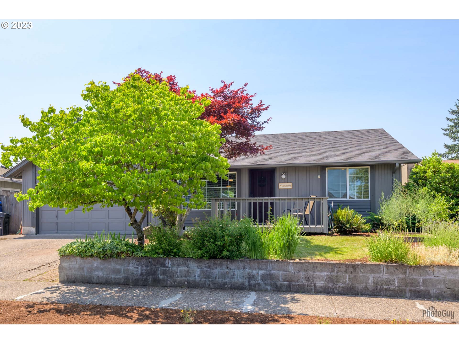 5621 C Street Springfield, OR 97478 - Photo 2 of 29 a front view of a house with garden
