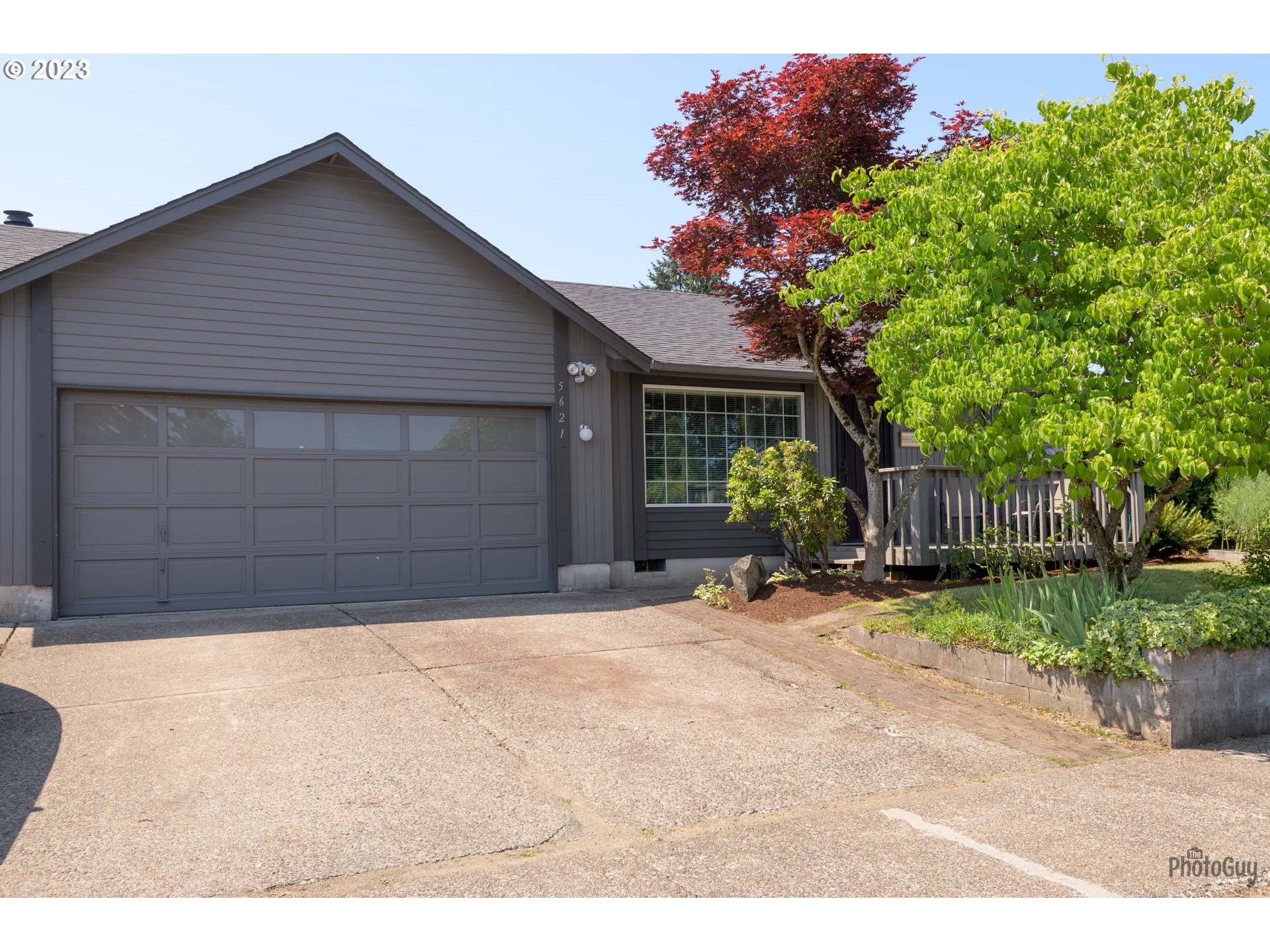 5621 C Street Springfield, OR 97478 - Photo 3 of 29 a front view of a house with a yard and a garage